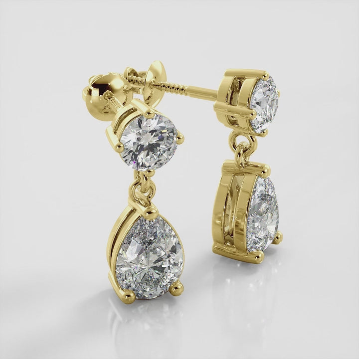 Alluring Round And Pear Shaped Drop Earrings